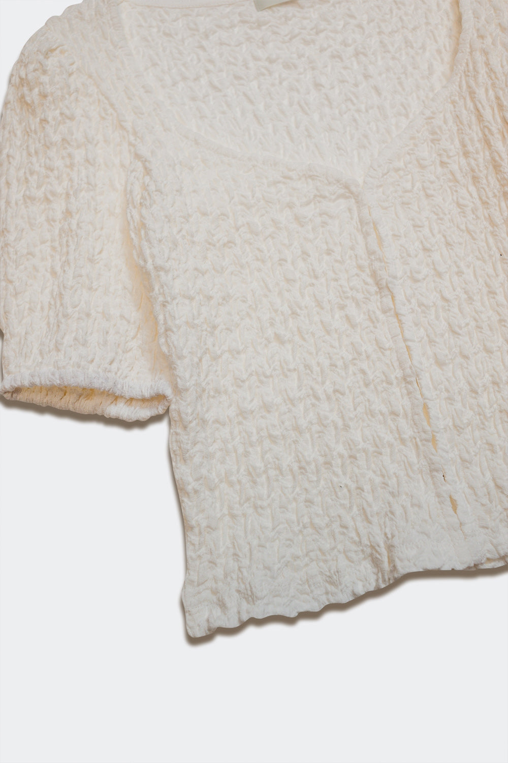 Top with balloon sleeves and hook-and-eye closure in white
