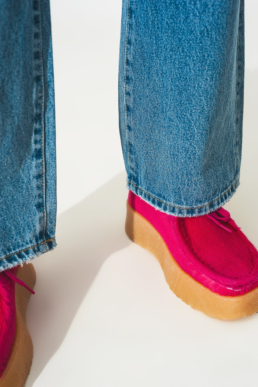 Straight jean in medium wash with rip and split hem