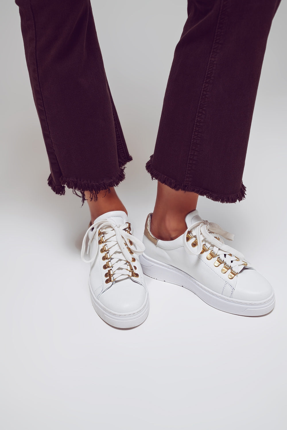 Flare jeans with raw hem edge in brown