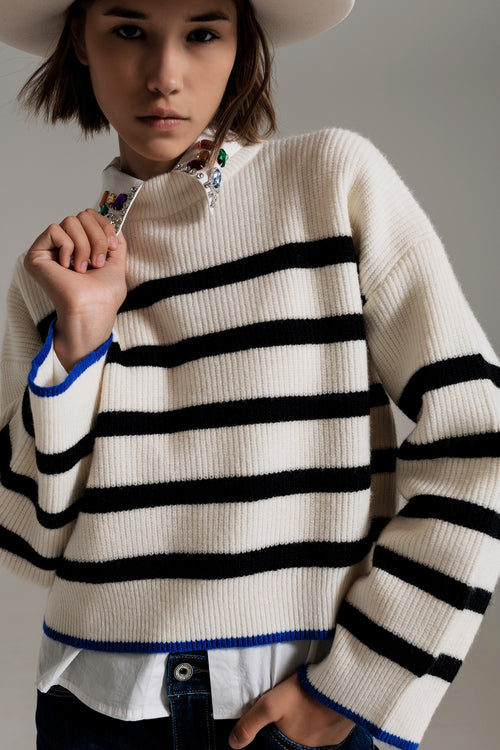 black striped jumper with blue stripe detail on the bottom — view 1 of 5