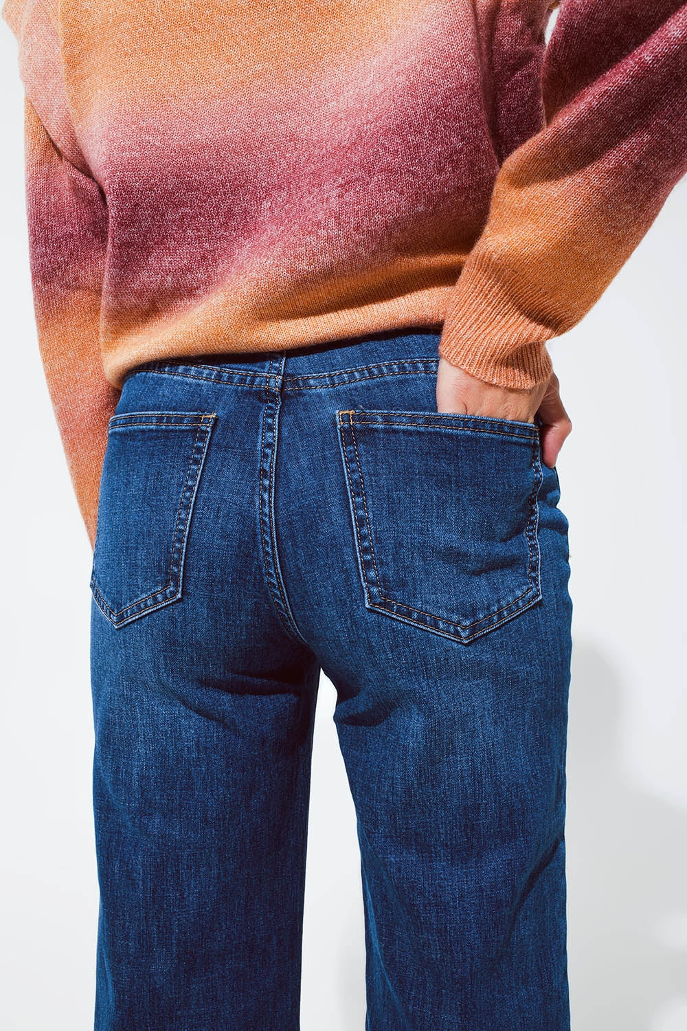 Blue flaired jeans with dark blue hem