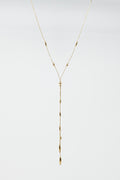 Long Gold Necklance with golden beads throughout and Long golden Tassle