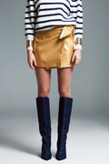 faux leather mini skirt with bow on the side in gold