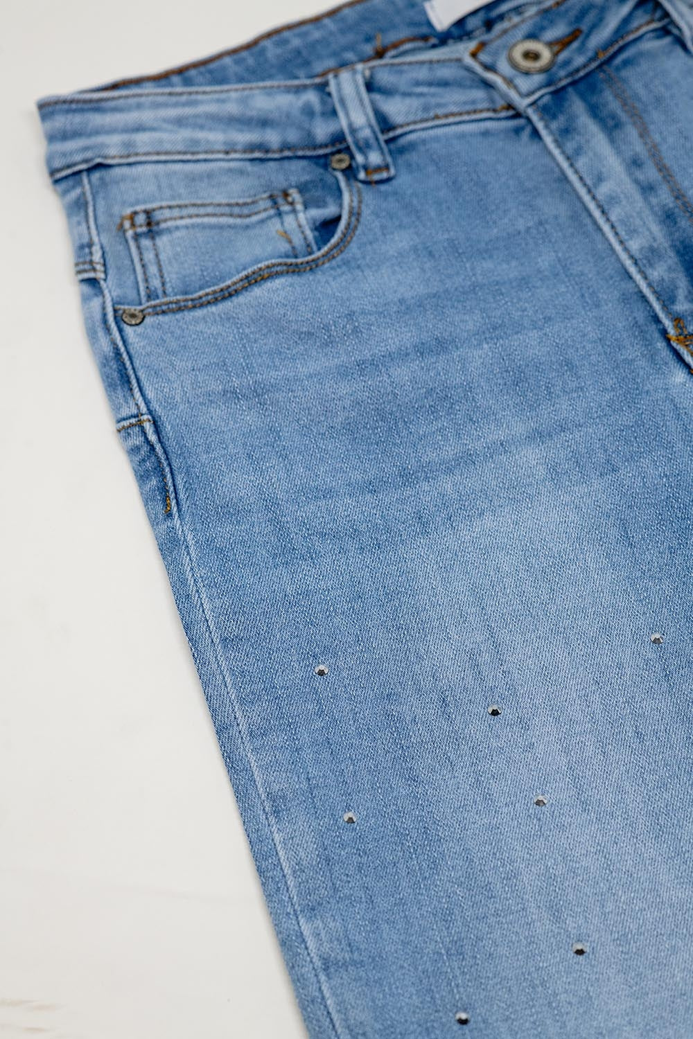 Five-pocket skinny jeans in stretch denim with strass detail all over