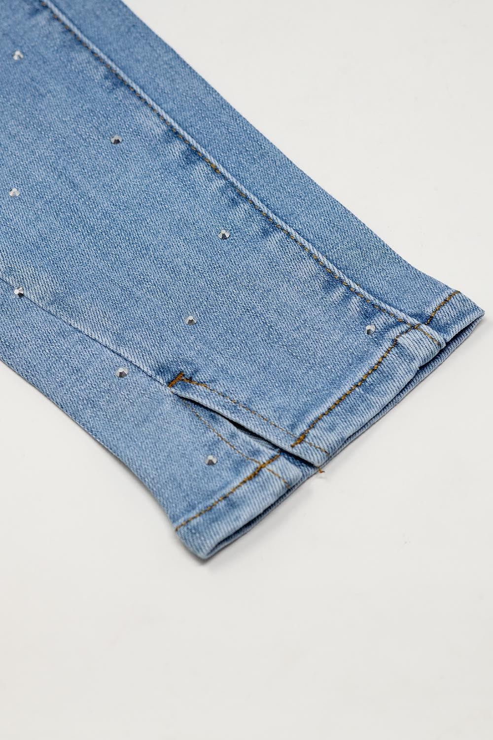 Five-pocket skinny jeans in stretch denim with strass detail all over