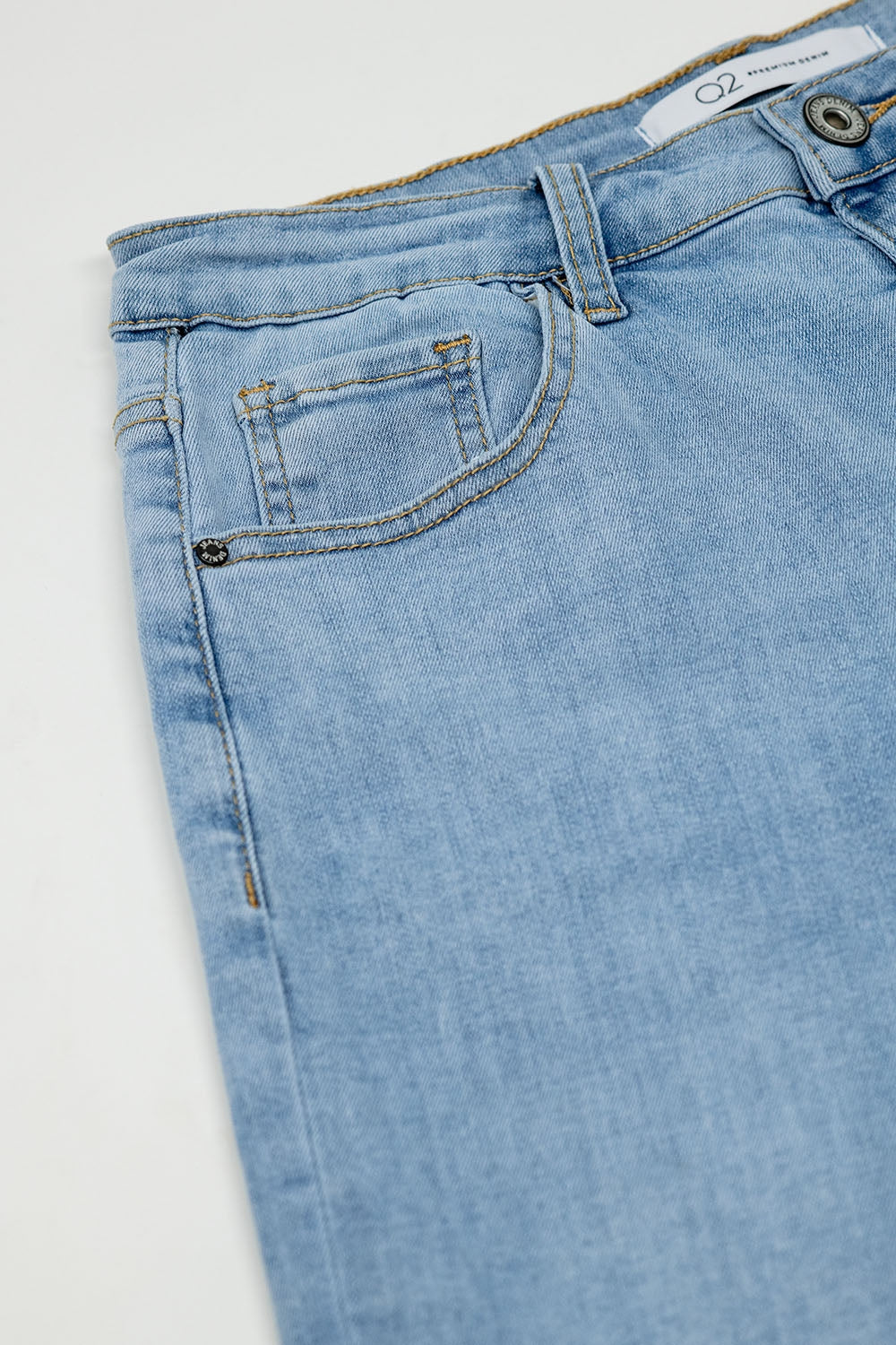 Boyfriend light blue jeans with stitching details on the edges