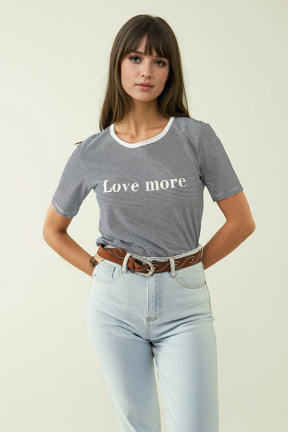 White T-shirt with black stripes and Love More texted