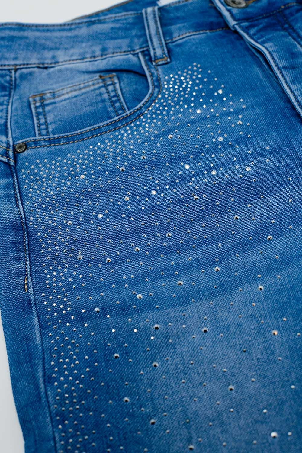 Skinny jeans in washed blue with strass all over the front
