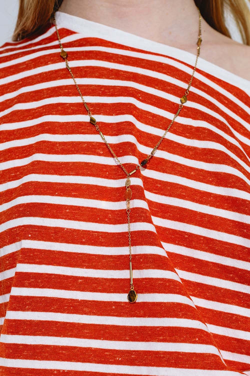 Golden necklace with stone detail and pendant