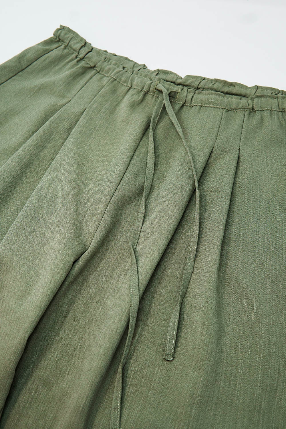 Light Green Relaxed Pants With Drawstring Closing And Side Pockets