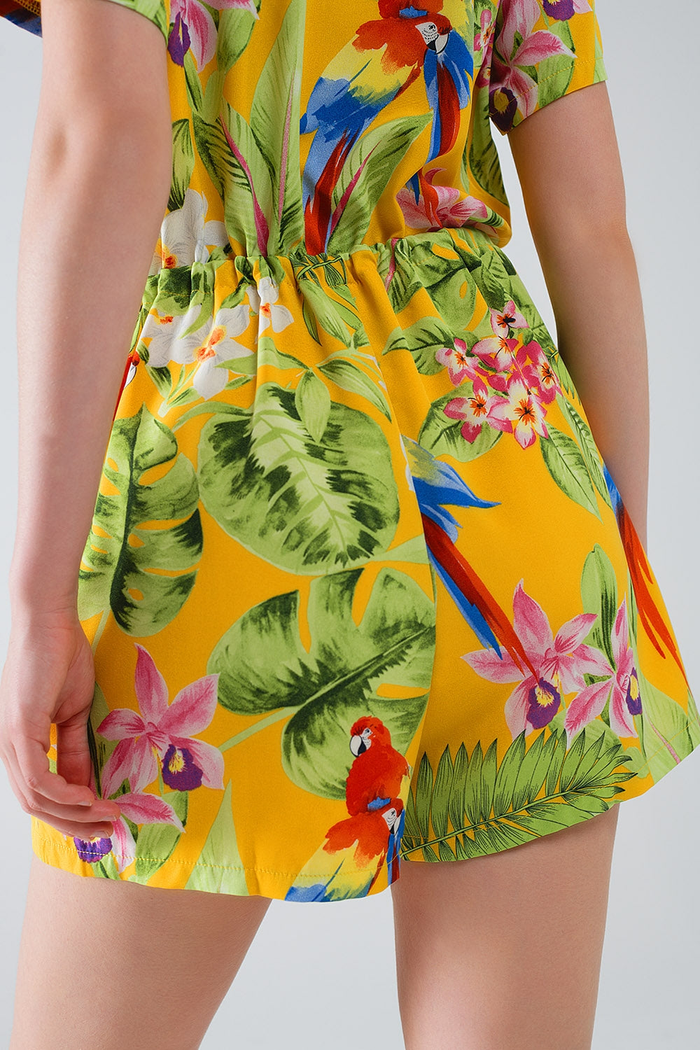 UNIKCOSA Yellow Short Jumpsuit with Tropical Print and Drawstring Closure