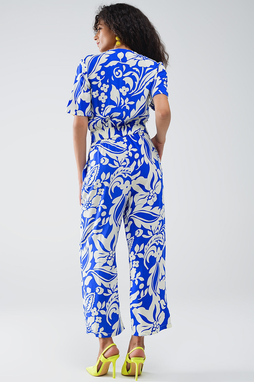 UNIKCOSA Short Sleeve Key Hole Front Floral Jumpsuit In Blue