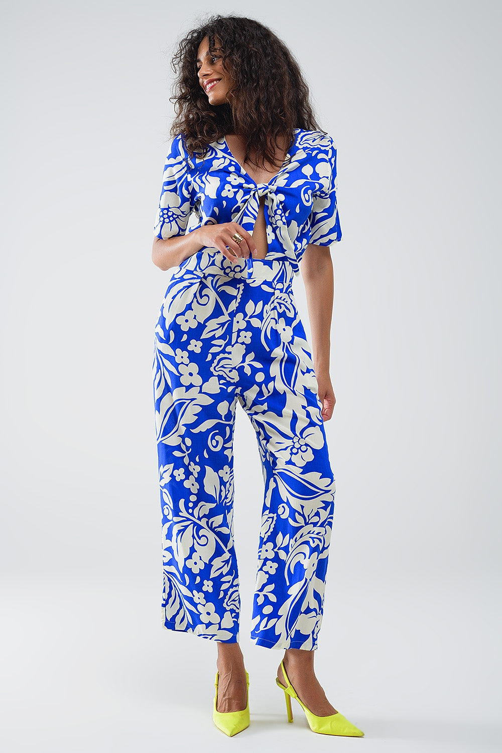 UNIKCOSA Short Sleeve Key Hole Front Floral Jumpsuit In Blue