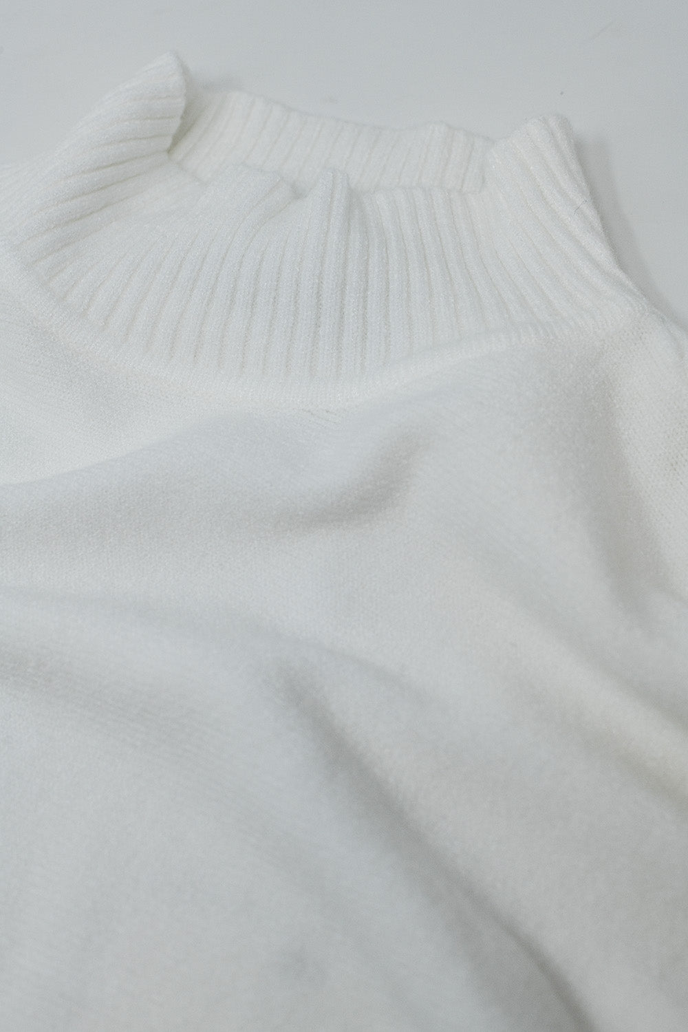 oversized soft knitted white sweater with ribbed sleeves