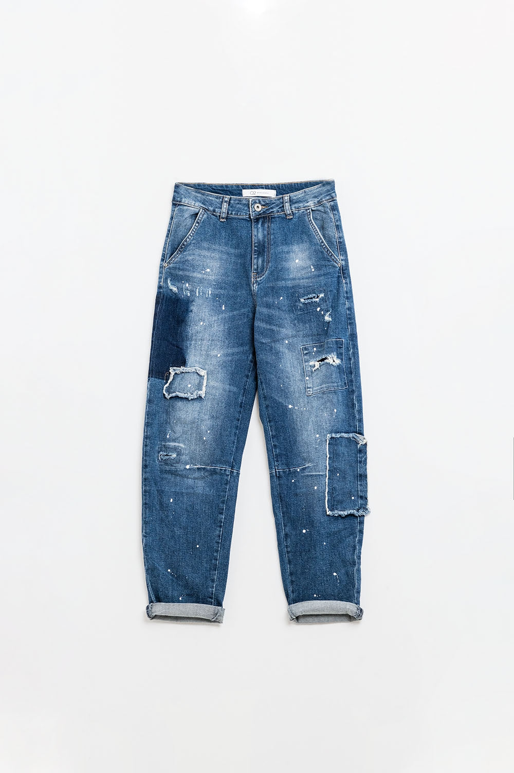 Loose-fitting jeans with distressed patches and paint details