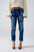 Loose blue jeans with subtle ripped design and patches