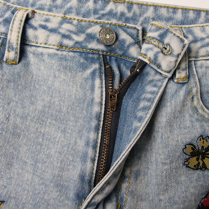 UNIKCOSA Women’s Vintage Washed Jeans – High-Waist Straight Denim with Hollow-Out Sun & Flower Print Design