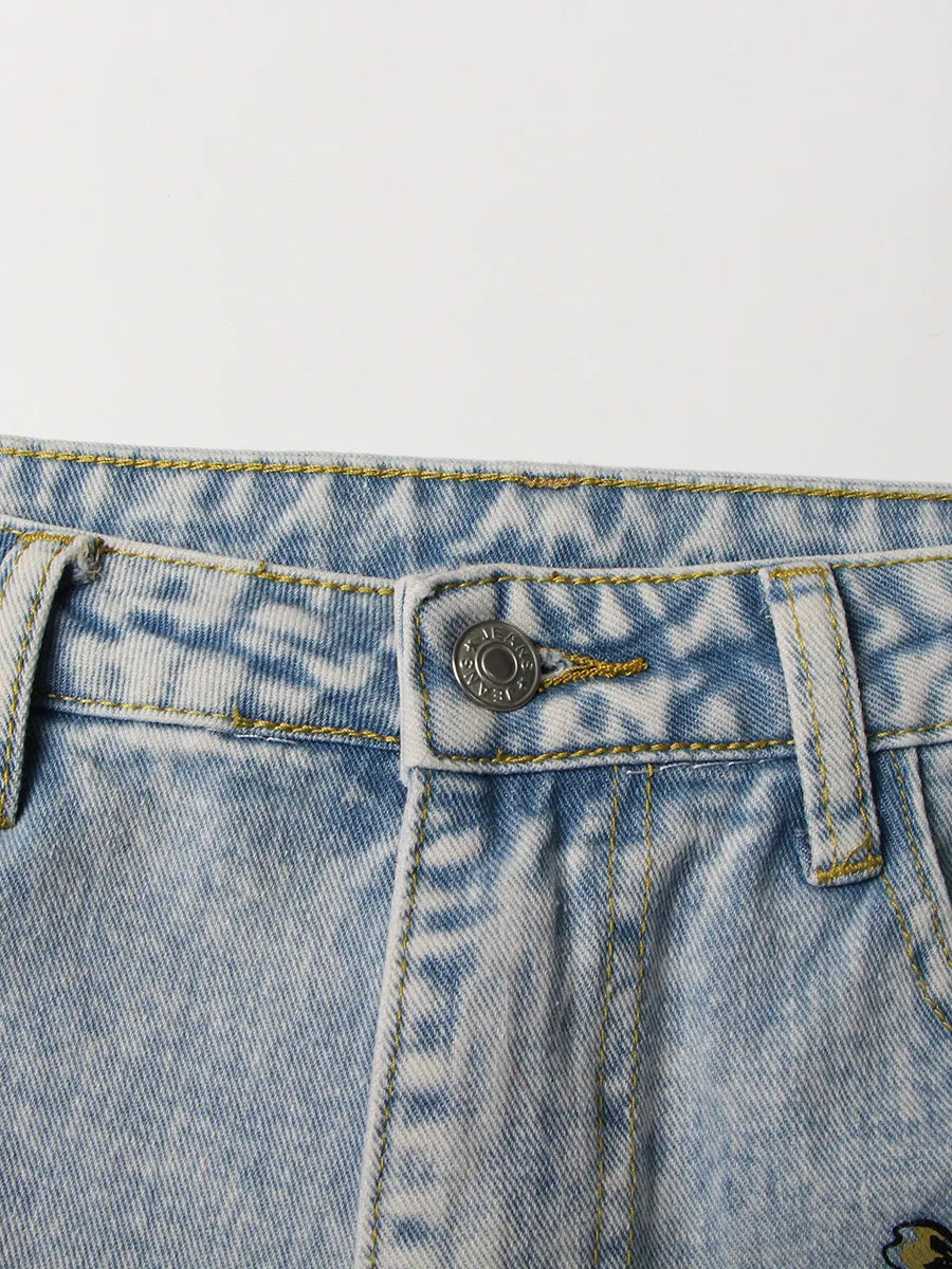 UNIKCOSA Women’s Vintage Washed Jeans – High-Waist Straight Denim with Hollow-Out Sun & Flower Print Design