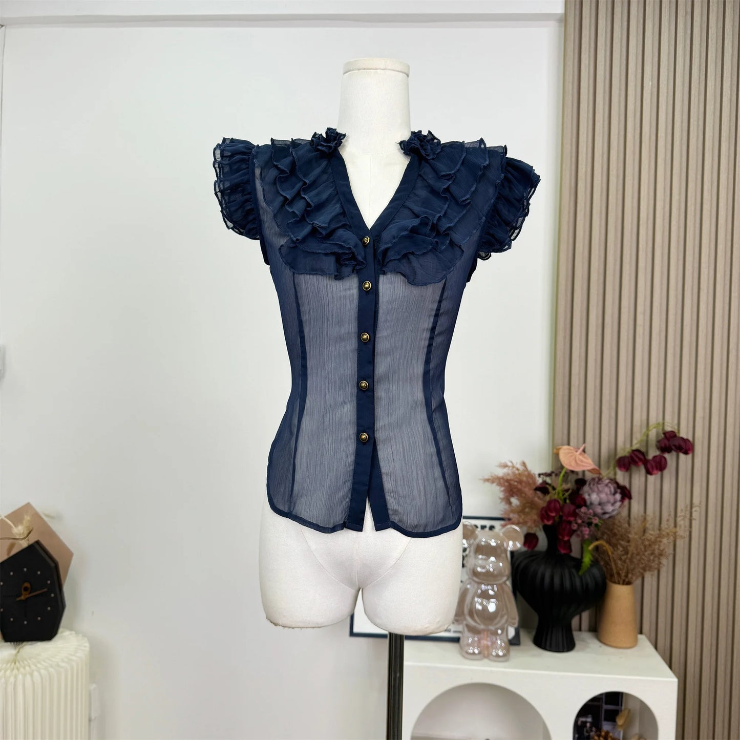 UNIKCOSA’s 2025 French Vintage Ruffle Blouse — Sleeveless V-Neck Coquette Chic
