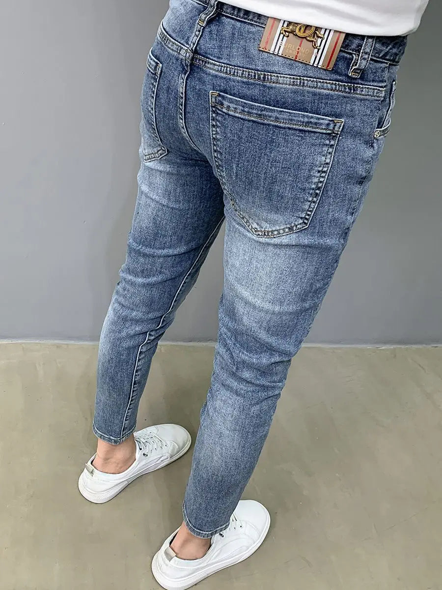 UNIKCOSA Men’s Slim Embroidered Jeans – Luxury Korean Fashion Pencil Pants (2024 Autumn/Summer Edition)