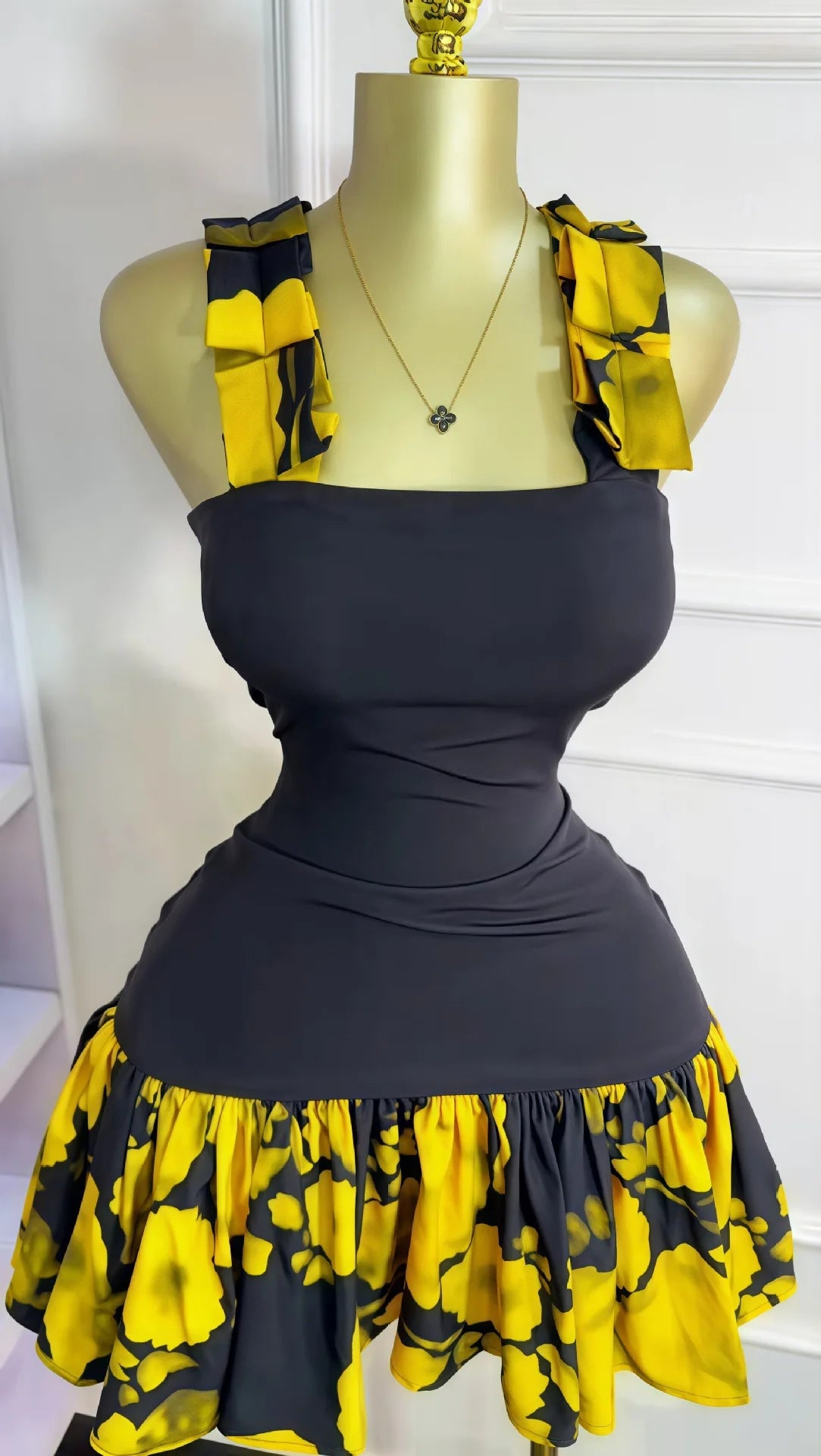UNIKCOSA’s Printed Pleated Mini Dress — Sleeveless Sheath Vacation Chic