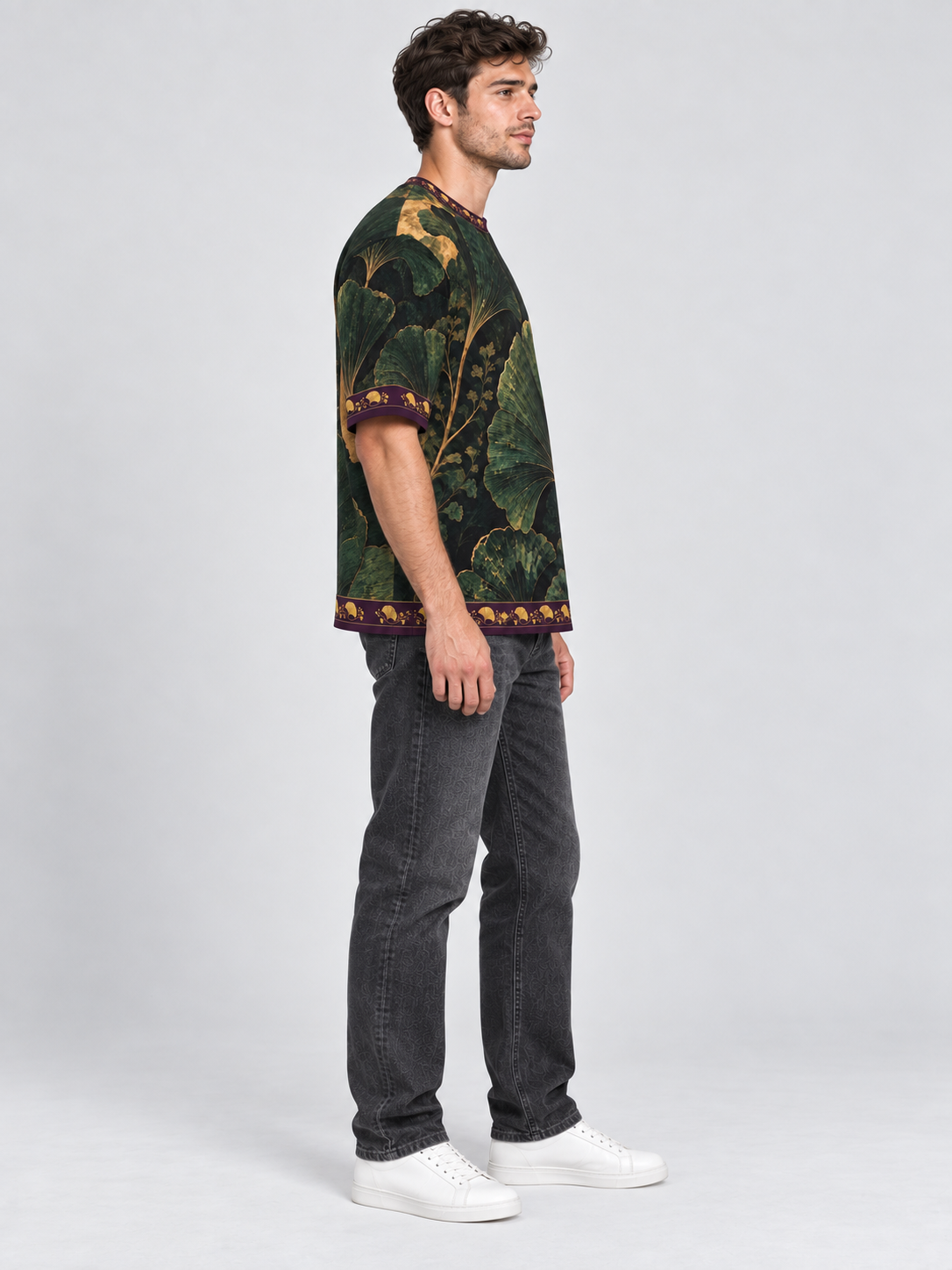 Verdant Ginkgo oversized cotton T-shirt side on adult model with washed-black denim — AI-generated styling illustration