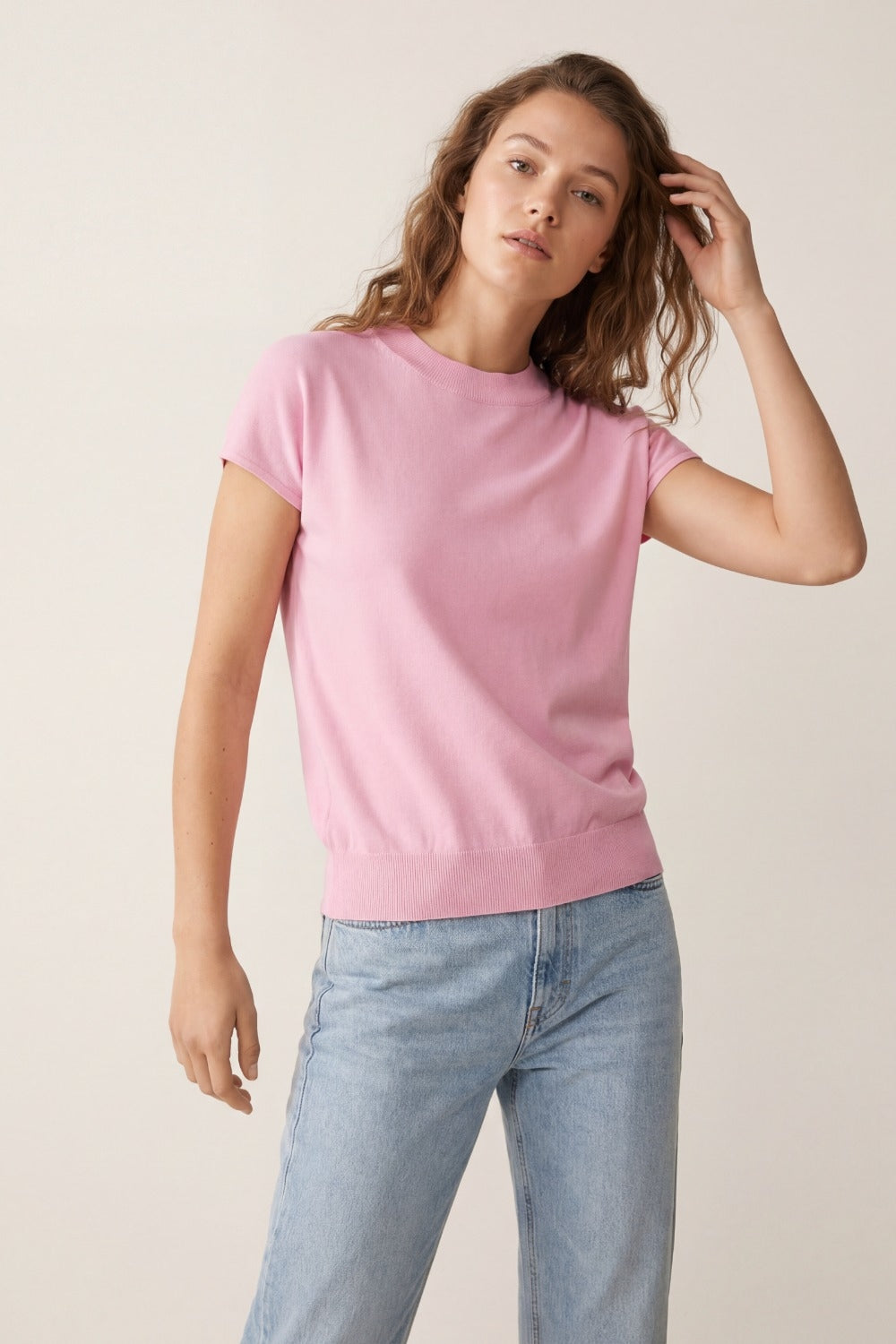 Baby pink turtleneck sweater with fitted short sleeves