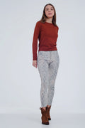 UNIKCOSA beige coloured pants with snake print