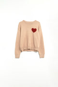 Q2 Beige sweater with red heart detail