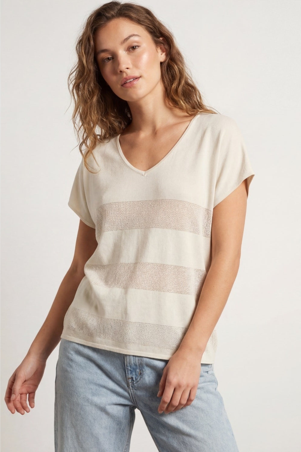 Beige V-neck knit sweater with open stitch detail