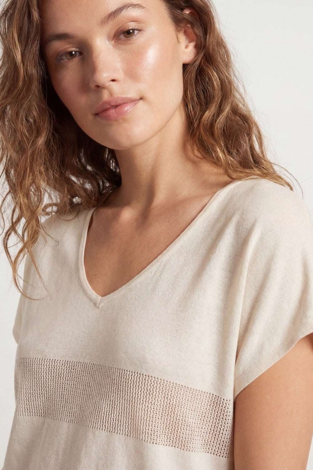 Beige V-neck knit sweater with open stitch detail