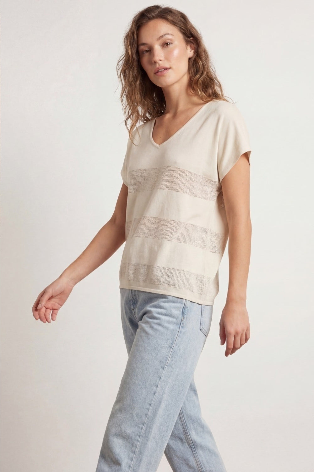 Beige V-neck knit sweater with open stitch detail