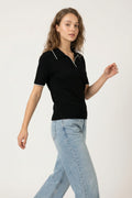 Black knit polo shirt with contrasting detail in white