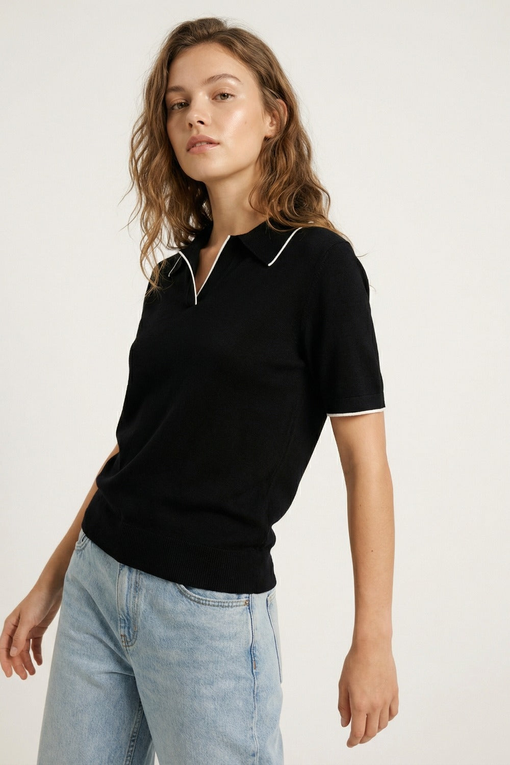 Black knit polo shirt with contrasting detail in white