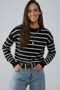 Black knit sweater with red heart detail and white striped