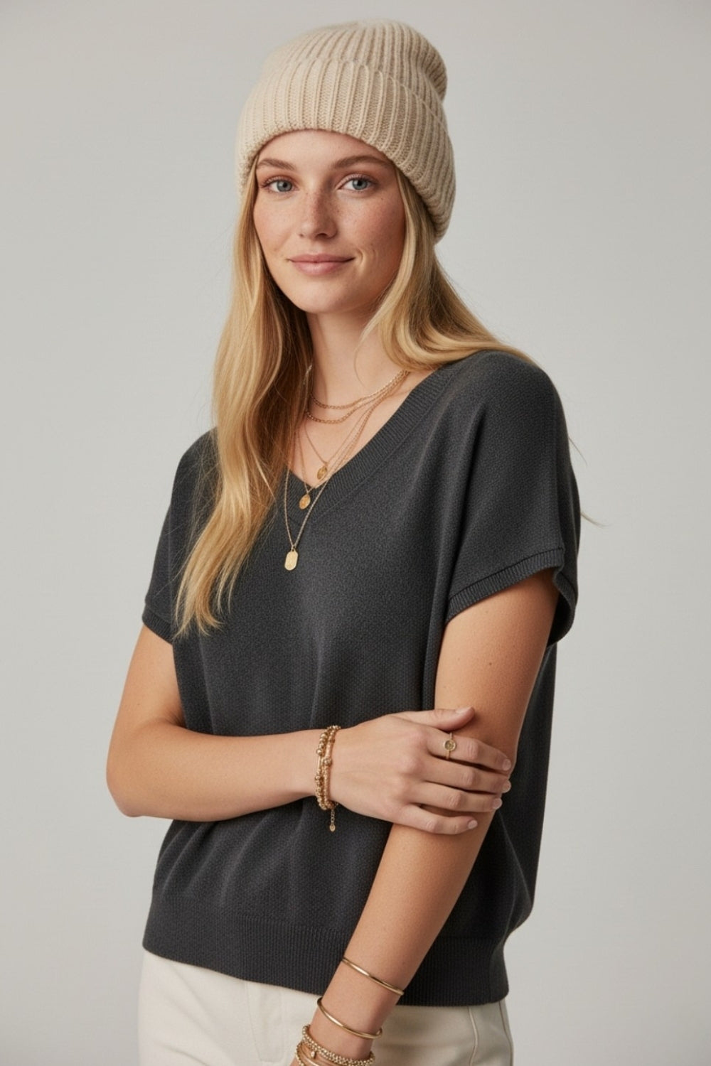 Black lightweight knit V-neck sweater with short sleeves
