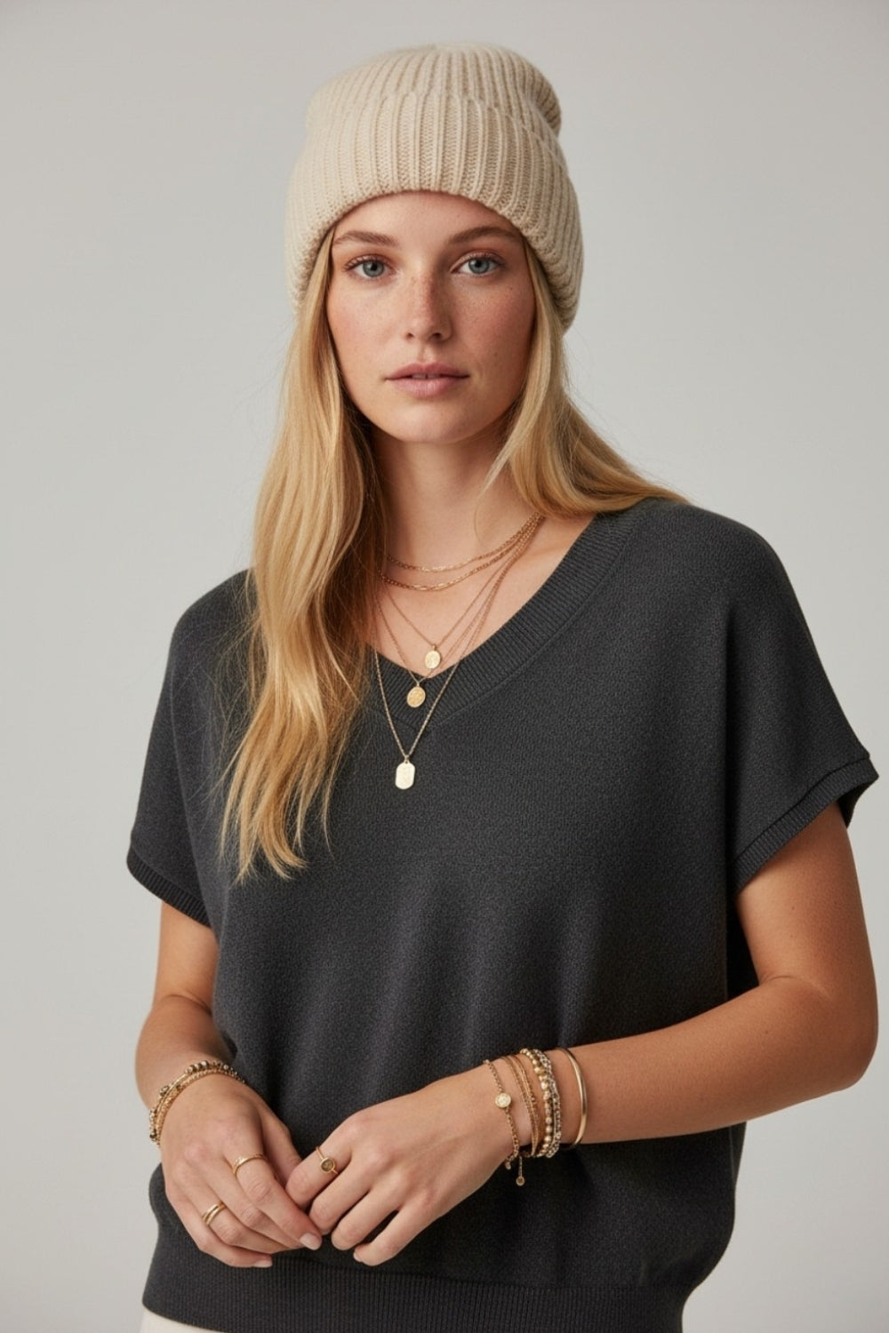 Black lightweight knit V-neck sweater with short sleeves