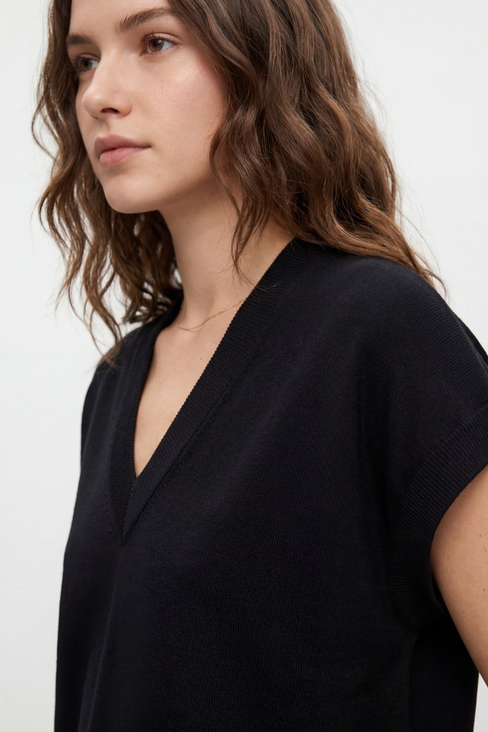 Black short-sleeve knit top with V-neck