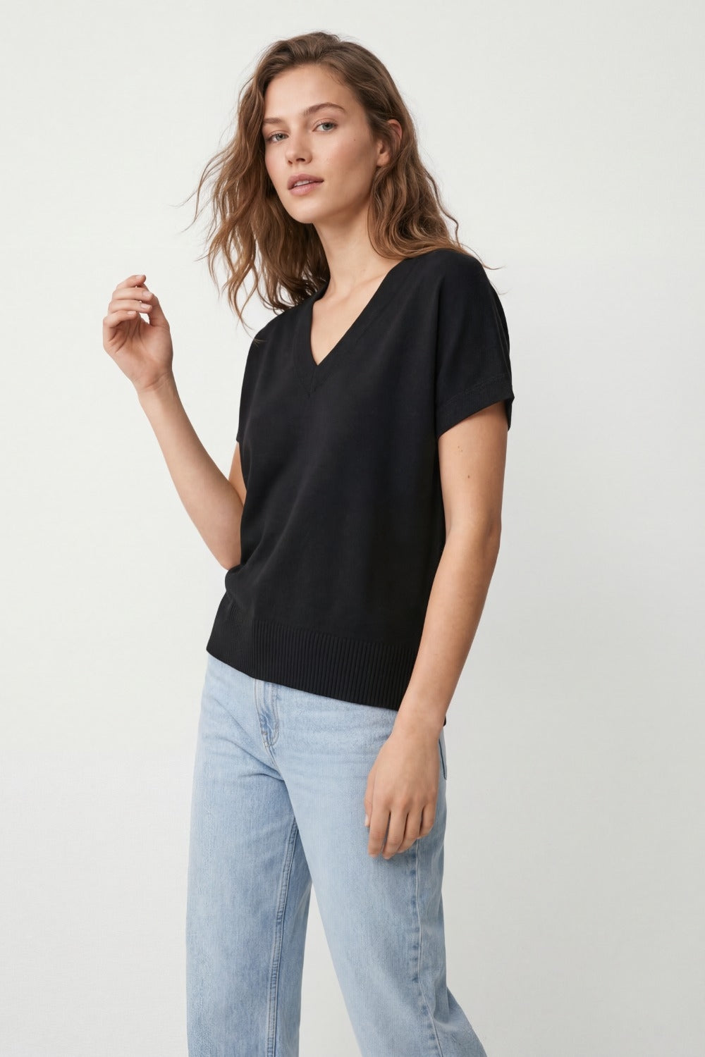 Black short-sleeve knit top with V-neck