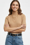 Fine knit sweater in beige with a high neck and elbow-length sleeves