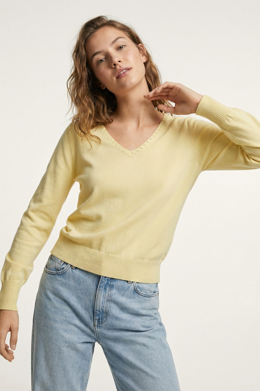Fine Knit V-Neck Sweater with Decorative Neckline Detail in yellow color