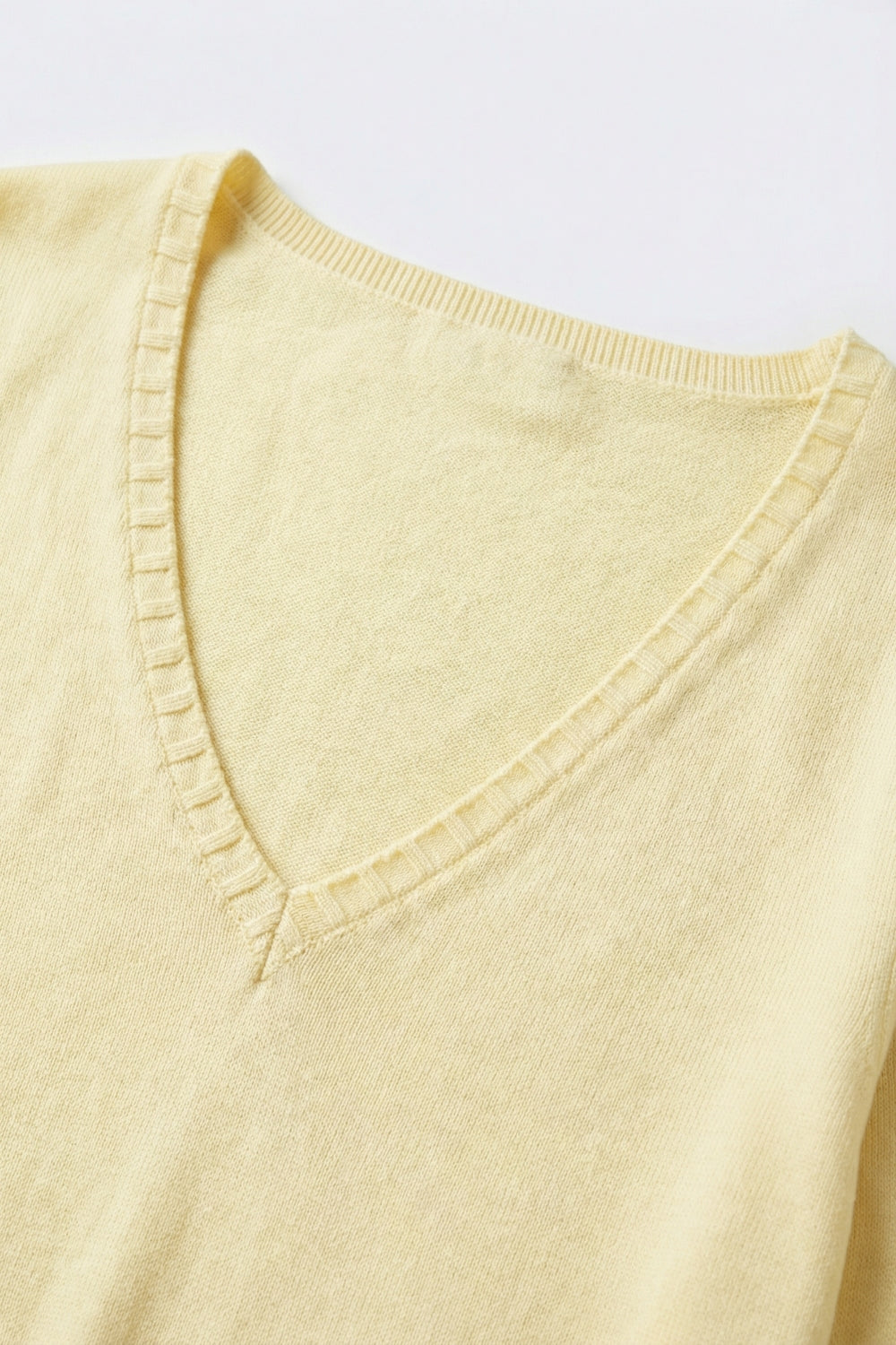 Fine Knit V-Neck Sweater with Decorative Neckline Detail in yellow color