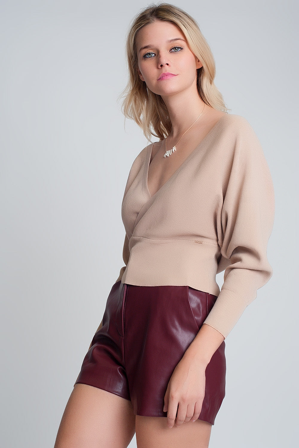 Knitted sweater with wrapped V-neck in beige