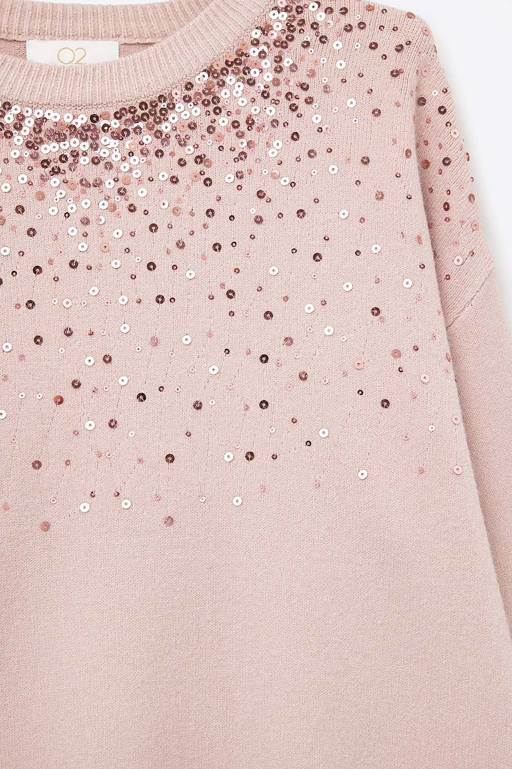 Pink soft knit sweater embellished with sequins on the front