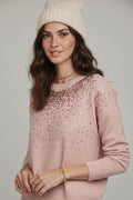 Pink soft knit sweater embellished with sequins on the front