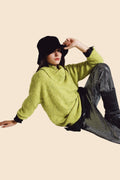 Q2 Sweater in green with a bardot neck.