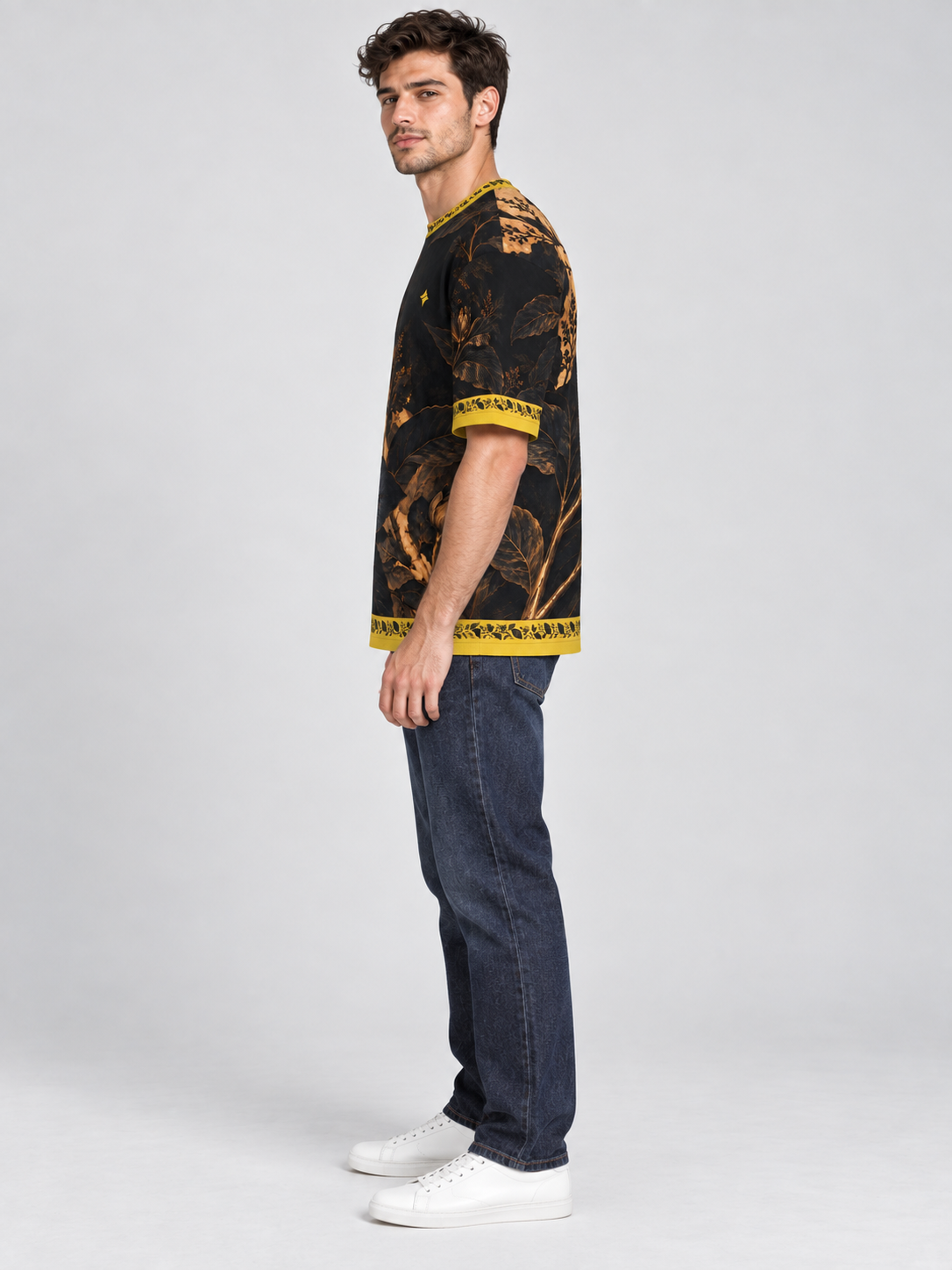Noir Botanica oversized cotton T-shirt — side model styling illustration with indigo jeans; AI-generated
