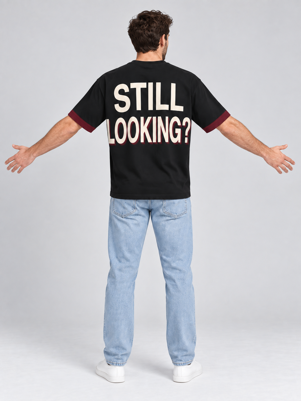 Not Your Type oversized cotton T-shirt — back with arms spread to show STILL LOOKING? lettering; AI-generated model styling illustration