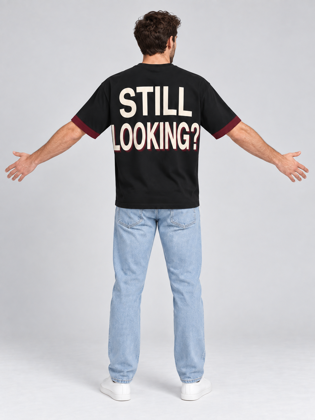 Not Your Type oversized cotton T-shirt — back with arms spread to show STILL LOOKING? lettering; AI-generated model styling illustration