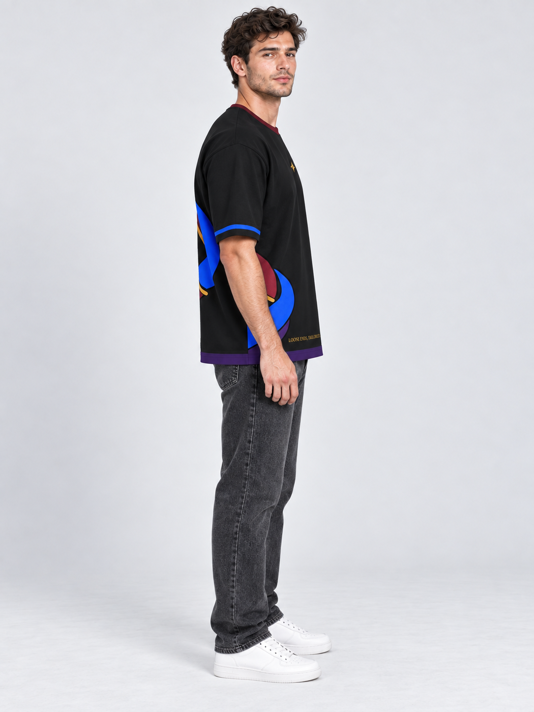 Loose Ends Atelier oversized cotton T-shirt — side on-model digital styling illustration with denim
